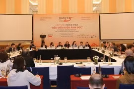 Filmmakers, experts, actors and actresses from Vietnam and Germany at the workshop to share experience in developing the cinema industry. (Photo: VNA)