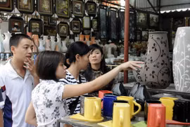 Customers at the traditional Bat Trang ceramic village. 