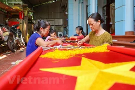 Visiting the village with more than 70 years of sewing national flags
