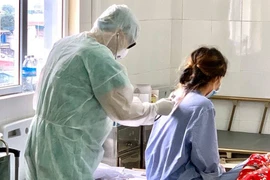 Doctors take care of COVID-19 patients
