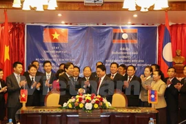 Vietnamese, Lao home affairs ministries boost cooperation 