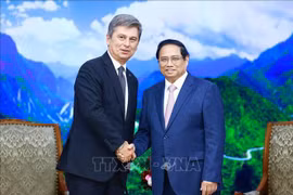 PM Pham Minh Chinh (R) and FIATA President Turgut Erkeskin (Photo: VNA)