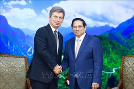 PM Pham Minh Chinh (R) and FIATA President Turgut Erkeskin (Photo: VNA)