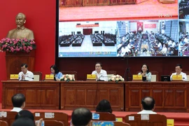 NA Chairman Tran Thanh Man (centre) meets with voters (Photo: VNA)