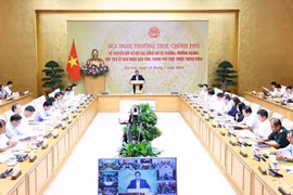 PM Pham Minh Chinh chairs the Government’s hybrid conference with ministers, heads of sectors and chairmen of the People’s Committees of centrally-run cities and province. (Photo: VNA)