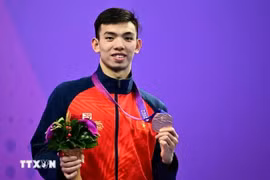Swimmer Nguyen Huy Hoang is among 16 Vietnamese athletes who will compete in the 2024 Paris Olympics later this month. (Photo: VNA)