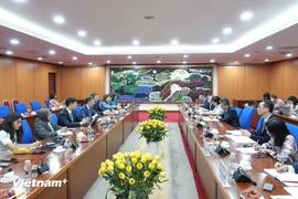 Deputy Minister of Finance Vo Thanh Hung has a working session with Paulo Medas, head of an IMF 2024 Article IV consultation team in Hanoi. (Photo: The Courtesy of the Finance Ministry)