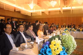 Deputy Prime Minister and Foreign Minister Pham Binh Minh (second, left) attends the banquet (Photo: VNA)