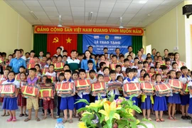 Lifebuoys designed like schoolbags presented to An Giang students