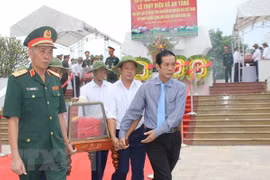 Quang Binh lays martyrs in Laos to rest 