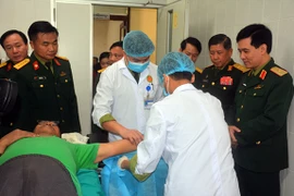 Vietnamese, Lao armies provide health care for 11,660 people