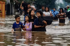 Indonesian floods kill two, force hundreds to evacuate