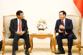Vietnam shares experience in developing cooperatives with Laos 
