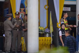 Thai clerk charged with murder after shooting gunman in court
