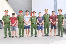 Vietnam hands over four wanted suspects to China