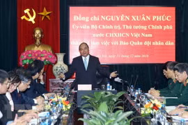 PM hails Quan doi Nhan dan newspaper for national contributions