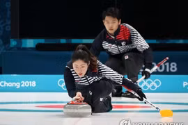 Curling, ski jumping kick off Winter Olympics 2018