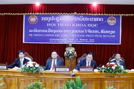 Vietnam, Laos review political system 