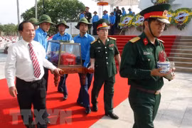 Quang Binh holds reburial service for remains of martyrs 