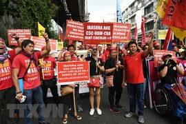 Philippine workers march to call for labour issue settlement