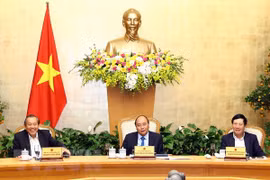 PM urges prompt resumption of work following Tet holiday