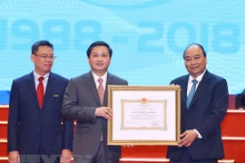 PM requests VietinBank to boost transparency, financial capacity
