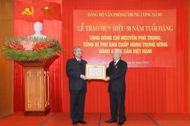 Party chief receives 50-year Party membership badge 