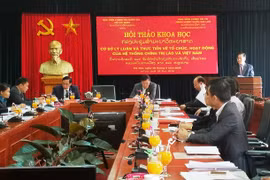Vietnam, Laos exchange experience in political system operation