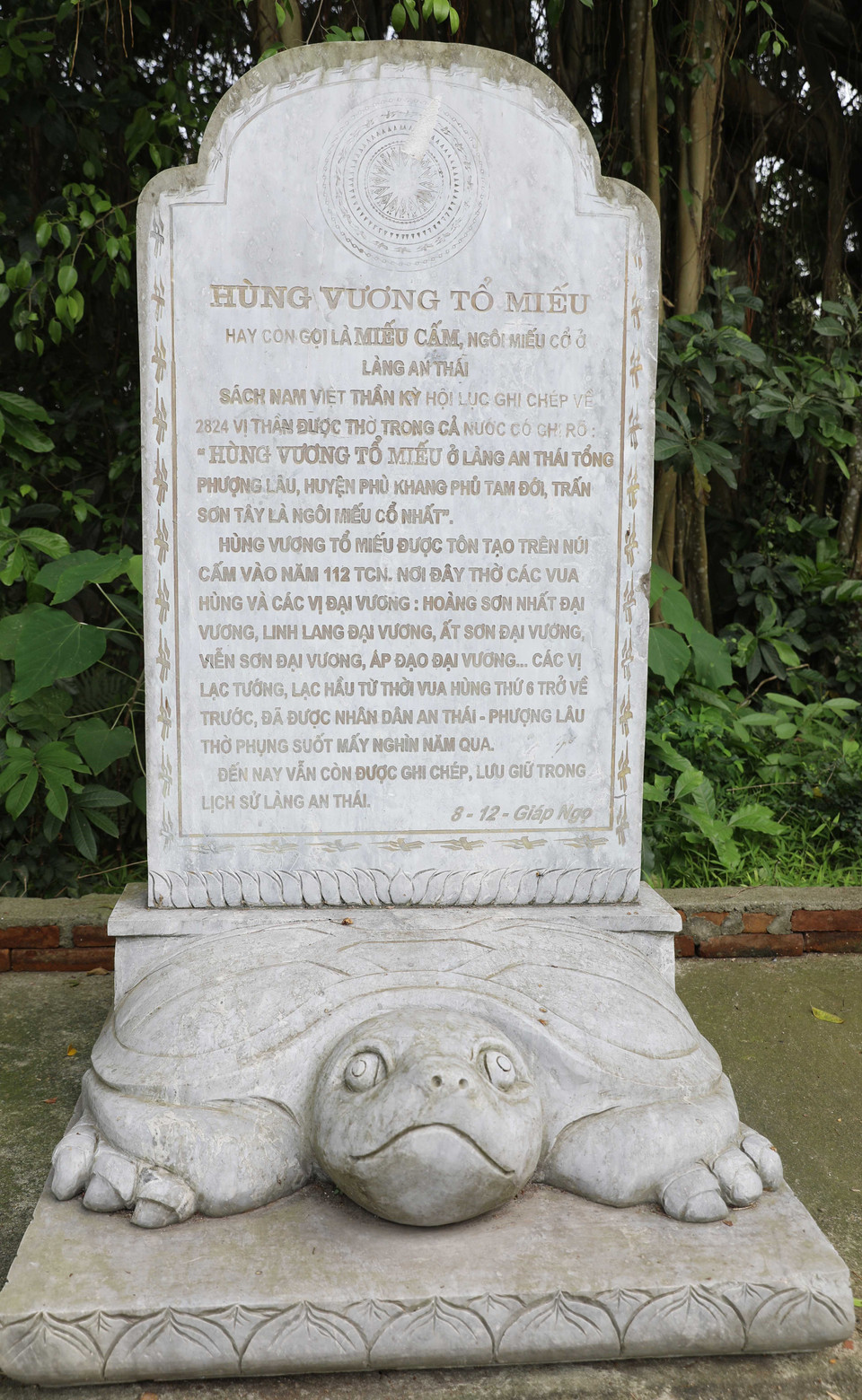 Stele inscribed with the name of the Hung Kings Ancestral Temple stands beside the shrine. (Photo: VNA)