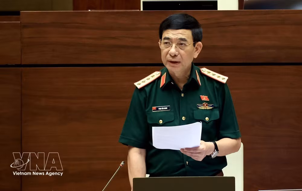 Deputy Prime Minister and Minister of National Defence Gen. Phan Van Giang clarifies some issues raised by National Assembly deputies. (Photo: VNA)
