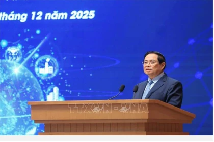 Prime Minister Pham Minh Chinh addresses the third National Forum on Digital Economy and Digital Society in Hanoi on December 20. (Photo: VNA)