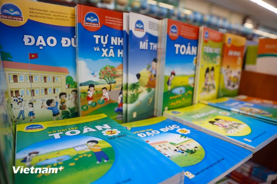 Complete textbook sets are now available at bookstores nationwide, ahead of the upcoming school year. (Photo: VietnamPlus)