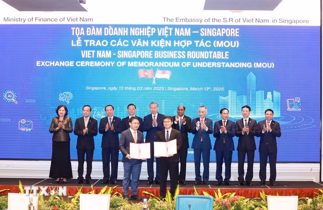 to-lam-business-pact-exchange-singapore-vna.jpg