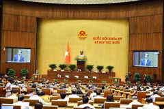 Deputies on October 22 morning listen to proposals and verification reports on three draft laws concerning the education sector. (Photo: VNA)