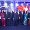 Party General Secretary To Lam, alongside Party and State leaders and delegates, visits the Vietnam News Agency’s display space. (Photo: VNA)