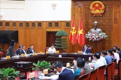 PM Pham Minh Chinh chairs a government meeting with the Ministries of Education and Training, and Health in Hanoi on March 25. (Photo: VNA)