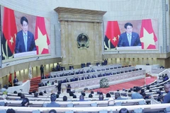 President Luong Cuong delivers a keynote policy address at the plenary session of the Angolan National Assembly on August 7. (Photo: VNA)