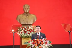 LPRP General Secretary and President of Laos Thongloun Sisoulith speaks at the grand ceremony in Vientiane on March 22. (Photo: VNA)