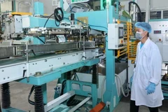 Vietnam Rice Compay Limited in Dong Thap province has invested in a modern rice packaging line for export. (Photo: nhandan.vn)