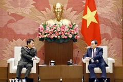 National Assembly Chairman Tran Thanh Man (R) and Minister of Public Security General Luong Tam Quang at a meeting on February 4 (Photo: VNA)