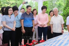 VNA General Director Vu Viet Trang (second from right) and generations of VNA leaders at the relic site. (Photo: VNA)