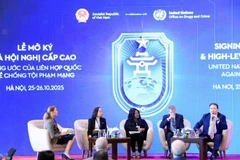Delegates at the roundtable on protecting women and children in cyberspace on October 26 (Photo: VNA)