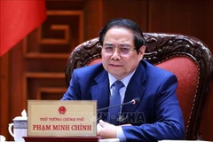 Prime Minister Pham Minh Chinh at the working session with leaders of ministries, sectors, and CT Group on August 13 (Photo: VNA)