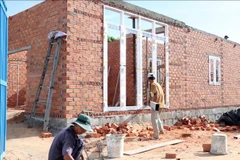 Workers build a house for a poor family in Thuan Nam district, Ninh Thuan province. (Photo: VNA)