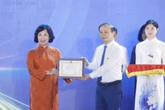 The Vietnam News Agency wins Prize A for its standout exhibition booth. (Photo: VNA)