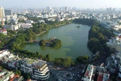 Hoan Kiem Lake, also known as the Lake of the Returned Sword, is a cultural landmark in Hanoi. (Photo: VNA)