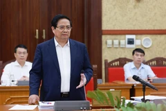 Prime Minister Pham Minh Chinh chairs a working session with the Standing Board of the Party Committee of Tay Ninh province on September 9. (Photo: VNA)