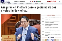 Prensa Latina's article on Vietnam’s assurance of smooth and effective transition to a leaner structure. (Photo: VNA)