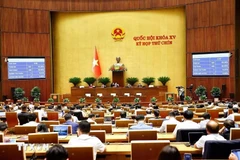 The NA adopts the resolution on tuition exemption and support in the national education system was approved with 440 out of 441 deputies present voting in favour. (Photo: VNA)