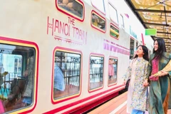 Tourists ride the “Five Gates” train, a new tourism product in Hanoi. (Photo: nhandan.vn)